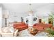 Bright living room with hardwood floors, high ceilings, and neutral-colored furniture and fixtures at 3049 Heathgate Ct, Lawrenceville, GA 30044