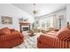 Cozy living room with fireplace, decorative rug, bright white walls, and natural lighting at 3049 Heathgate Ct, Lawrenceville, GA 30044