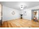 Open living room with wood floors, white walls, and modern decor at 3049 Heathgate Ct, Lawrenceville, GA 30044
