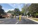 Gated entrance to a neighborhood, with security features, and surrounding trees at 4701 Flat Shoals Rd # 68D, Union City, GA 30291