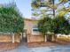 Inviting brick townhome featuring a secure front entrance surrounded by mature trees at 4701 Flat Shoals Rd # 68D, Union City, GA 30291