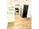 Efficient kitchen with stainless steel appliances, white cabinets and wood-look flooring at 4701 Flat Shoals Rd # 68D, Union City, GA 30291