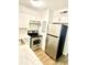Cozy kitchen featuring stainless steel appliances, white cabinets, and wood-look flooring at 4701 Flat Shoals Rd # 68D, Union City, GA 30291