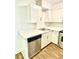 Bright kitchen with stainless steel dishwasher, white cabinets, and modern countertops at 4701 Flat Shoals Rd # 68D, Union City, GA 30291