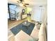 Staged living room showcases a cozy sofa and open access to the dining area at 4701 Flat Shoals Rd # 68D, Union City, GA 30291