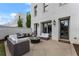 Cozy back patio with a fire pit and comfortable seating, perfect for enjoying outdoor evenings at 323 S Esplanade, Alpharetta, GA 30009