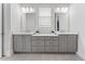 Stylish bathroom featuring double sinks, quartz countertops, and sleek gray cabinetry at 323 S Esplanade, Alpharetta, GA 30009
