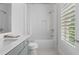 Clean bathroom with a shower-tub combination and neutral-toned walls at 323 S Esplanade, Alpharetta, GA 30009