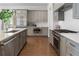 Modern kitchen featuring stainless steel appliances, gray cabinets, and a bright, open design at 323 S Esplanade, Alpharetta, GA 30009