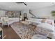 Spacious living room with an open floor plan, hardwood floors, and seamless flow to the kitchen at 323 S Esplanade, Alpharetta, GA 30009