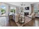 Bright and airy living room with a fireplace, hardwood floors, and access to the outdoor patio at 323 S Esplanade, Alpharetta, GA 30009