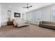 Spacious main bedroom featuring a ceiling fan, shutters, and a neutral color palette at 323 S Esplanade, Alpharetta, GA 30009
