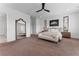 Bright main bedroom with neutral decor, large mirrors, and comfortable seating at 323 S Esplanade, Alpharetta, GA 30009