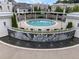 Gorgeous community pool area with beautiful fountain, seating, and meticulously landscaped grounds at 323 S Esplanade, Alpharetta, GA 30009