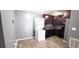 Well-equipped kitchen with modern appliances, dark cabinets, and ample counter space at 4701 Flat Shoals Rd # 25F, Union City, GA 30291
