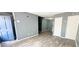 Inviting living room featuring hardwood floors, staircase, and a neutral color palette at 4701 Flat Shoals Rd # 25F, Union City, GA 30291