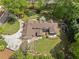 Aerial view of a large, well-maintained property with lush greenery and a sprawling home with a rear deck at 299 Saint Marys Nw Ln, Marietta, GA 30064
