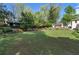 Large backyard with well-maintained lawn, various garden and landscape features, and additional structure at 299 Saint Marys Nw Ln, Marietta, GA 30064
