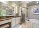 Neutral-toned bathroom featuring tub, walk-in shower and vanity with makeup area at 299 Saint Marys Nw Ln, Marietta, GA 30064