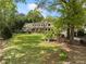 Charming home nestled among mature trees and a beautiful lawn, with lovely curb appeal at 299 Saint Marys Nw Ln, Marietta, GA 30064