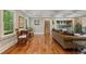 Elegant living room with hardwood floors, coffered ceiling, and abundant natural light at 299 Saint Marys Nw Ln, Marietta, GA 30064