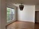 Inviting living room showcasing recessed lighting, beautiful hardwood floors, and a large window at 341 Bailey Walk, Alpharetta, GA 30009