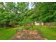 A well-maintained backyard with patio and established landscaping at 1137 Eagles Nest Cir, Carrollton, GA 30116