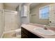 Bathroom with a vanity, toilet, shower with glass doors, and neutral walls at 1137 Eagles Nest Cir, Carrollton, GA 30116