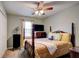 Bedroom with neutral walls, carpet flooring, and a ceiling fan with light at 1137 Eagles Nest Cir, Carrollton, GA 30116