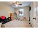 Bedroom with neutral carpet, ceiling fan, and window for natural light at 1137 Eagles Nest Cir, Carrollton, GA 30116