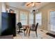Sunny breakfast nook with tile flooring, small dining table, and view of the backyard at 1137 Eagles Nest Cir, Carrollton, GA 30116