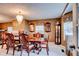 Elegant dining room with chandelier, decorative mirrors and window treatments, and a formal dining set at 1137 Eagles Nest Cir, Carrollton, GA 30116