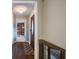 Inviting hallway with hardwood floors, leading to various rooms, enhancing the home's charm and appeal at 1137 Eagles Nest Cir, Carrollton, GA 30116