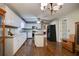 The white kitchen features an island, modern appliances, ample counter space, and wood flooring at 1137 Eagles Nest Cir, Carrollton, GA 30116