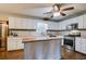 Bright kitchen boasts an island, stainless steel appliances, and light cabinetry, creating a spacious feel at 1137 Eagles Nest Cir, Carrollton, GA 30116