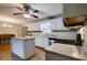 Open-concept kitchen with island, stainless steel appliances, plenty of storage, and wood flooring at 1137 Eagles Nest Cir, Carrollton, GA 30116