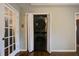 A laundry closet with stackable washer and dryer units provides convenient space-saving for laundry tasks at 1137 Eagles Nest Cir, Carrollton, GA 30116
