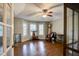 Inviting living room features hardwood floors, ceiling fan, and plenty of natural light from the bay window at 1137 Eagles Nest Cir, Carrollton, GA 30116