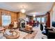 Spacious living area features elegant lighting, fireplace, seating area, and dining table in one space at 1137 Eagles Nest Cir, Carrollton, GA 30116