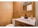 Cozy powder room with a modern vanity, decorative mirror, and neutral paint at 1137 Eagles Nest Cir, Carrollton, GA 30116