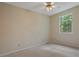 Clean and bright bedroom with neutral carpet and a window providing natural light at 1950 Lower Burris Rd, Canton, GA 30114