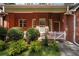 Welcoming front porch with brick facade and manicured landscaping at 1950 Lower Burris Rd, Canton, GA 30114