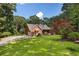 Beautiful brick home with dormers and a well-maintained lawn at 1950 Lower Burris Rd, Canton, GA 30114