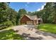 Side view of brick home showing garage and landscaped yard at 1950 Lower Burris Rd, Canton, GA 30114