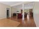 An open-concept living room with hardwood floors, fireplace, built-in bookcases, and recessed lighting exudes cozy charm at 1950 Lower Burris Rd, Canton, GA 30114