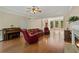 A spacious living room with a fireplace, built-in bookshelves, and hardwood floors flows seamlessly with other spaces at 1950 Lower Burris Rd, Canton, GA 30114