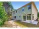 Green house backyard with patio and sun room for relaxing or entertaining at 3677 Trillium Forest Dr, Snellville, GA 30039