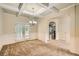 Dining room with coffered ceilings, wainscoting, and French doors to outside at 3677 Trillium Forest Dr, Snellville, GA 30039