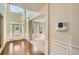 Bright foyer with hardwood floors, soaring ceilings, and wainscoting at 3677 Trillium Forest Dr, Snellville, GA 30039
