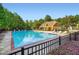A large community pool surrounded by lounge chairs offers a relaxing outdoor amenity at 3677 Trillium Forest Dr, Snellville, GA 30039